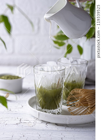 Cold matcha tea with milk and ice 119339525