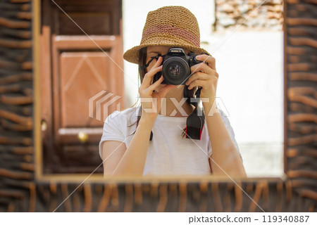 Girl photographer - straw hat full length self portrait female traveler shooting Girl photographer - straw hat full length self portrait female traveler shooting 119340887