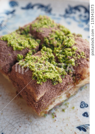 Enjoy the delicious Cold Baklava Slices that come with a delightful Pistachio Topping 119341073