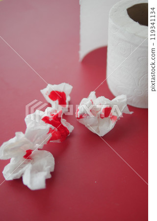 Blood on the tissues on light green background  119341134