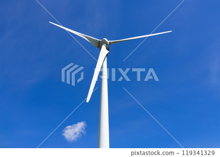 Close-up of a wind turbine on the background of blue sky with a cloud. Close-up of a wind turbine on the background of blue sky with a cloud. 119341329