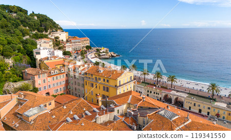 Aerial view of Nice, France, featuring colorful Mediterranean buildings, palm-lined Promenade des Anglais, and the azure waters of the Mediterranean Sea 119341550