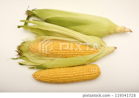 Three ears of corn on a white background. A printed cob. Ripe corn. 119341728