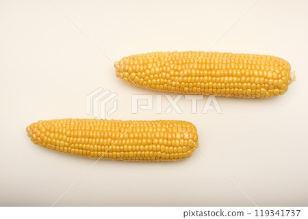Three peeled ears of corn on a white background. A printed cob. Ripe delicious corn. Three peeled ears of corn on a white background. A printed cob. Ripe delicious corn. 119341737