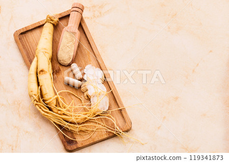 Ginseng and Supplements on a wooden board 119341873