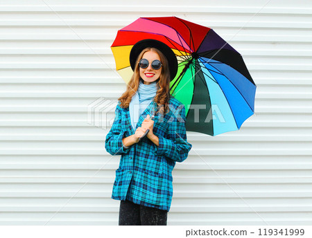 Fashion happy pretty smiling woman with colorful umbrella on white background Fashion happy pretty smiling woman with colorful umbrella on white background 119341999
