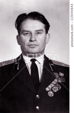 USSR - CIRCA 1962: An old photo shows a portrait of a lieutenant of the Soviet Army in uniform 119343643