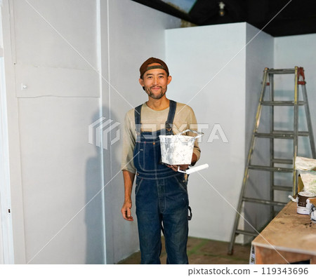 Man doing DIY indoors 119343696