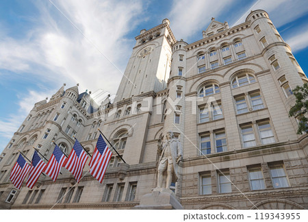 Old Post Office building with Benjamin Franklin Statue and American flags 119343955