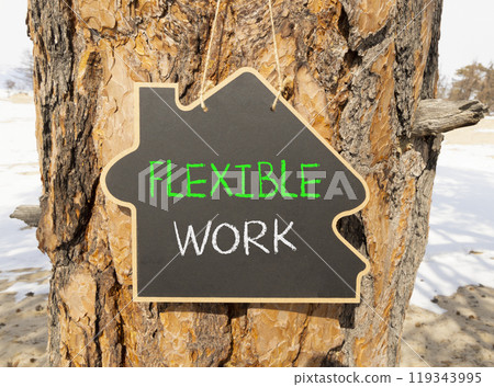 Flexible work symbol. Concept words Flexible work on beautiful yellow blackboard. Beautiful old tree background. Business Flexible work concept. Copy space. Flexible work symbol. Concept words Flexible work on beautiful yellow blackboard. Beautiful old tree background. Business Flexible work concept. Copy space. 119343995