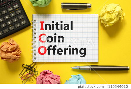 ICO initial coin offering symbol. Concept words ICO initial coin offering on beautiful white note. Beautiful yellow background. Black calculator. Business ICO initial coin offering concept. Copy space 119344010