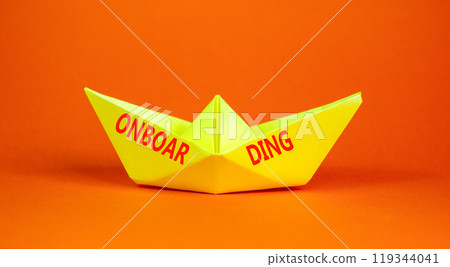 Onboarding success symbol. Concept word Onboarding on beautiful yellow paper boat. Beautiful orange background. Business onboarding success concept. Copy space. Onboarding success symbol. Concept word Onboarding on beautiful yellow paper boat. Beautiful orange background. Business onboarding success concept. Copy space. 119344041