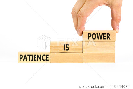 Patience is power symbol. Concept words Patience is power on beautiful wooden blocks. Beautiful white table white background. Businessman hand. Business and patience is power concept. Copy space. 119344071