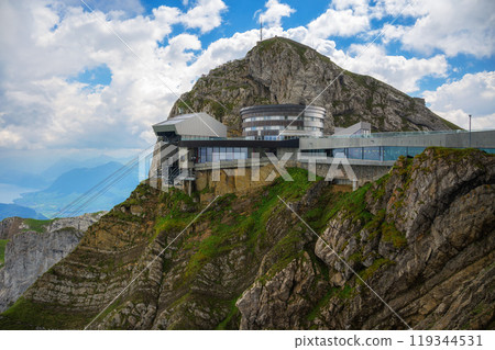 Mount Pilatus in Switzerland with a cable car station and a mountain resort 119344531