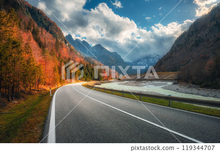 Winding mountain road at colorful sunset in golden autumn 119344707
