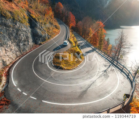 Aerial view of winding mountain road at sunset in autumn 119344719