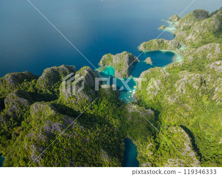 Lagoons and Lake surrounded by splendid limestone rock formation and scenic mountain. Coron, Palawan. Philippines. Lagoons and Lake surrounded by splendid limestone rock formation and scenic mountain. Coron, Palawan. Philippines. 119346333