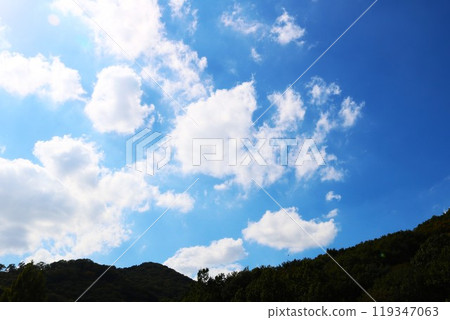 Bright autumn sky and white clouds, a peaceful scene Bright autumn sky and white clouds, a peaceful scene 119347063
