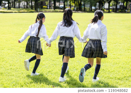 Back view of a student walking in uniform 119348082