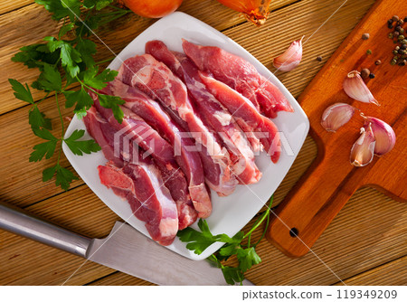 Raw sliced turkey thigh 119349209