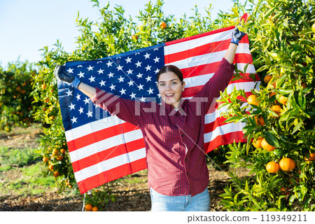 Portrait of a young farmer woman with the flag of USA Portrait of a young farmer woman with the flag of USA 119349211