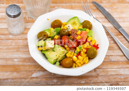 Fresh salad with olives, tomatoes, corn and cheese on plate Fresh salad with olives, tomatoes, corn and cheese on plate 119349307
