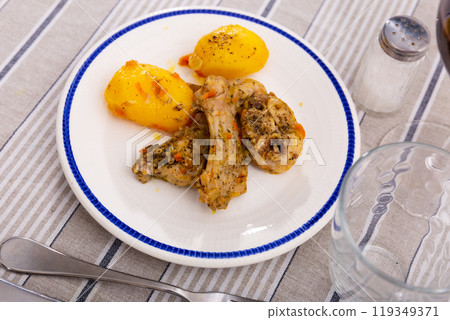 Appetizing stew with rabbit pieces and potatoes. Healthy hearty dinner 119349371