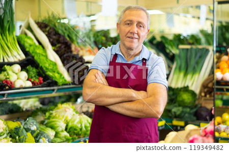 vegetable salesman in supermarket 119349482
