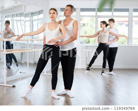 Young man and young woman rehearsing pair ballet Young man and young woman rehearsing pair ballet 119349769