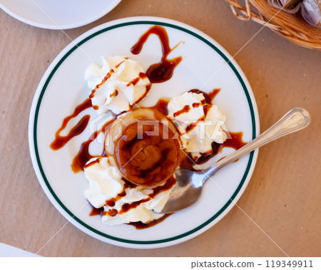 Sweet european dessert flan with whipped cream 119349911