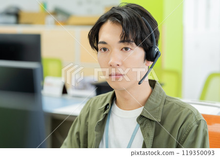 Male operator working in the office Male operator working in the office 119350093