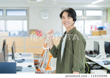 Male operator working in the office Male operator working in the office 119350096