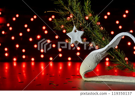 Christmas star with word RISEN of air dry clay handmade Christmas decor on dark bokeh background. Children air dry clay activity handicraft idea. Preparing for Christmas holiday decorating. Modern Christmas star with word RISEN of air dry clay handmade Christmas decor on dark bokeh background. Children air dry clay activity handicraft idea. Preparing for Christmas holiday decorating. Modern 119350137