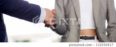 Closeup hands of businessman handshake with partner at office. 119350417