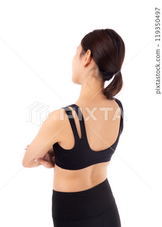 Portrait of beautiful young asian woman in sportswear and crossed arms isolated. Portrait of beautiful young asian woman in sportswear and crossed arms isolated. 119350497