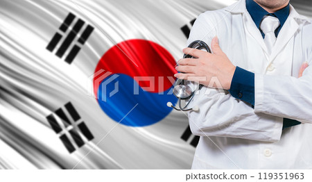 Doctor with stethoscope on South Korean flag. Doctor with crossed arms on South Korean flag. Medical health and care on South Korean flag 119351963