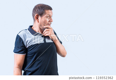 Surprised senior people with open mouths looking to the side. Astonished old man looking at a promotion aside, holding his chin 119352362