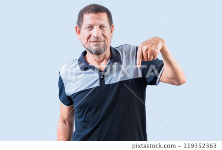Senior old man pointing an advertisement down isolated. Smiling senior man pointing at a banner down 119352363