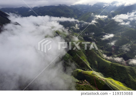 Landscape of Morning Mist with Mountain Layer. mountain ridge and clouds in rural jungle bush forest Landscape of Morning Mist with Mountain Layer. mountain ridge and clouds in rural jungle bush forest 119353088