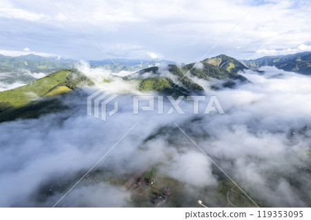 Landscape of Morning Mist with Mountain Layer at north of chiang rai Thailand. mountain ridge and clouds in rural jungle bush forest Landscape of Morning Mist with Mountain Layer at north of chiang rai Thailand. mountain ridge and clouds in rural jungle bush forest 119353095