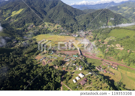 Landscape of Morning Mist with Mountain Layer at north of chiang rai Thailand. mountain ridge and clouds in rural jungle bush forest Landscape of Morning Mist with Mountain Layer at north of chiang rai Thailand. mountain ridge and clouds in rural jungle bush forest 119353108
