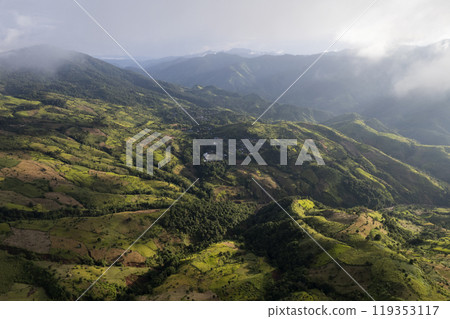 Landscape of Morning Mist with Mountain Layer at north of chiang rai Thailand. mountain ridge and clouds in rural jungle bush forest 119353117