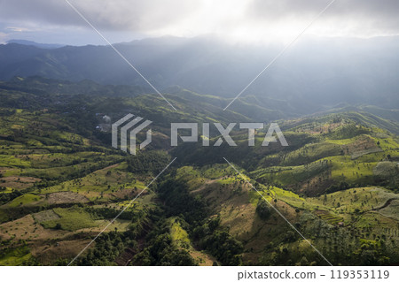 Landscape of Morning Mist with Mountain Layer. mountain ridge and clouds in rural jungle bush forest Landscape of Morning Mist with Mountain Layer. mountain ridge and clouds in rural jungle bush forest 119353119