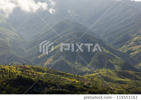 Landscape of Morning Mist with Mountain Layer. mountain ridge and clouds in rural jungle bush forest 119353161