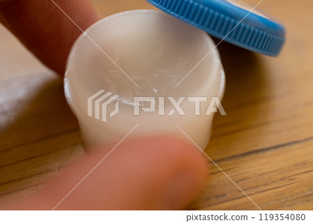 Ointment in an ointment container Ointment in an ointment container 119354080