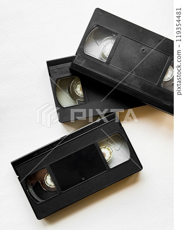 Retro vhs tapes on white background reflecting vintage technology 119354481