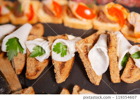Appetizing Platter of Assorted Canap s Featuring Fresh Ingredients and Colorful Toppings 119354607