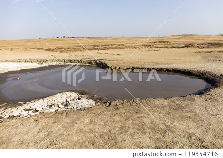 photo of a mud volcano eruption, landscape photography 119354716