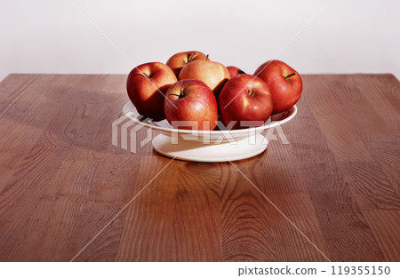 Red apples in white plate Red apples in white plate 119355150