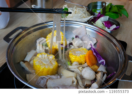 Tom Yam spicy soup. cook instant noodle soup in Vietnam in a restaurant cook in the middle of the table cook Asian traditional cuisine in restaurant. 119355373